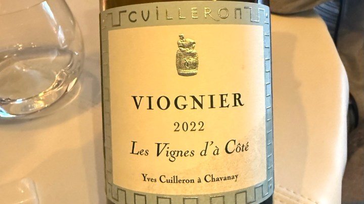 A close-up of a wine bottle label featuring Cuilleron Viognier 2022, labeled 'Les Vignes d'à Côté', from Yves Cuilleron in Chavanay.