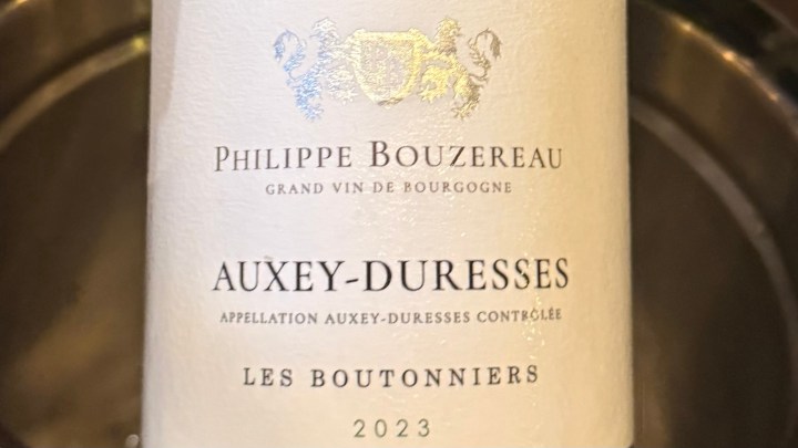 Close-up of a wine label from Philippe Bouzereau, featuring the name 'Auxey-Duresses' and the year '2023'.